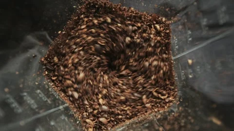 Electric coffee grinder working process, beans are bounced and then milled Stock Footage 247192290