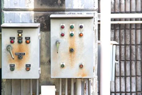Electric control box and wall concrete and old and electrical power control b Stock Photos