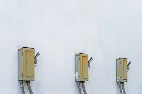 Electric control box and wall concrete and old and electrical power control b Stock Photos