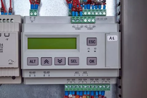 Electric controller for automation of technological processes in production. Stock Photos