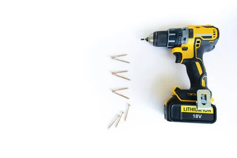 Electric cordless screwdriver,self-tapping screws laid as bulleted list template Foto stock