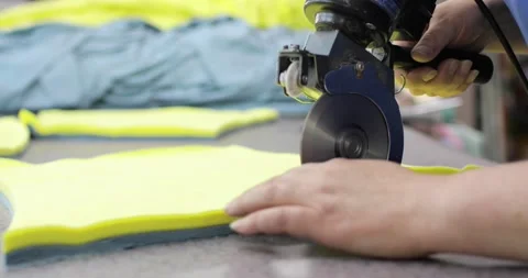 Electric cutter Fabric Machine. Cutting a fabrics in an workshop. Studio. Видео 157356956