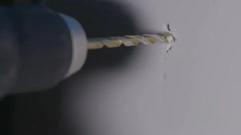 Electric Drill Creates Hole In Wall Close Up Slow Motion Stock Footage 144904902