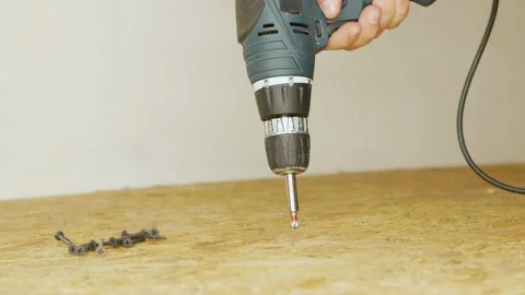 Electric drill unscrew the self-tapping screw from a oriented strand board. Stock Footage 201255742