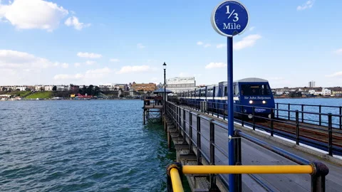 Electric driven train on the longest pleasure pier in the world at Southend-on Stock Footage 138803104