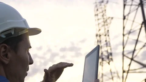 Electric energy concept, technology. engineer works with a tablet. Industrial Stock Footage 146354027
