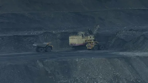 Electric excavator loads a mining dump truck Stock Footage 77235785