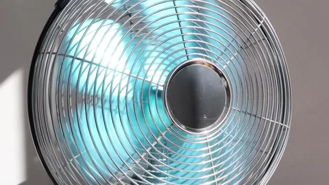 Electric fan rotating quickly in bright sunshine. Calm relaxed atmosphere Stock Footage 155919653