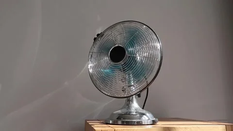 Electric fan rotating quickly in bright sunshine. Calm relaxed atmosphere 스톡 동영상 155919738