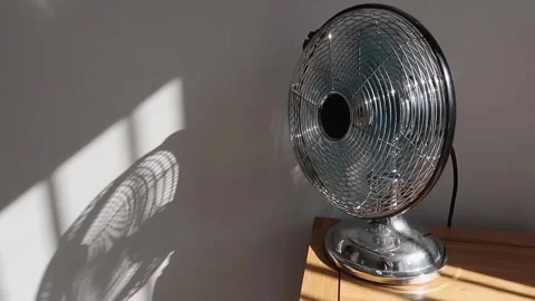 Electric fan rotating quickly in bright sunshine. Calm relaxed atmosphere Stock Footage 155919754