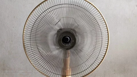 The electric fan table at the front side is spinning in the room Stock Footage 300364314