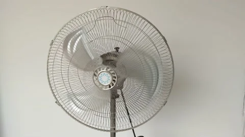 Electric fan Ventilator turning from side to side blowing wind. air fan cooling Stock Footage 198570962