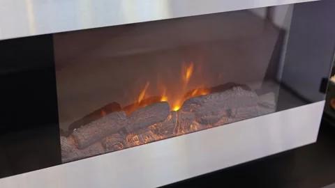 An electric fireplace in which a fire burns Stock Footage 285647890
