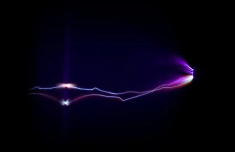 Electric flashover occurring between two electrodes due to corona effect. Stock Photos