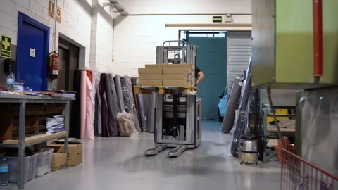 Electric fork lifter inside a warehouse factory working class labor concept 動画素材 263541953