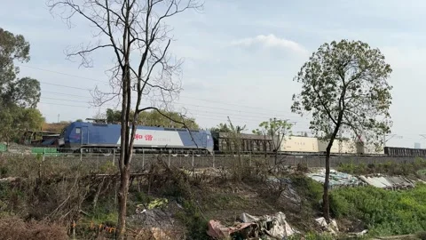 Electric freight train transporting containers in Chengdu China Video stock 334701277
