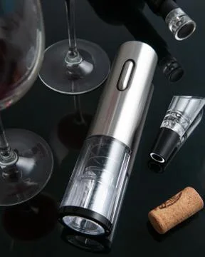 Electric gray metal corkscrew, aerator and vacuum stopper for wine. On a blac Stock Photos