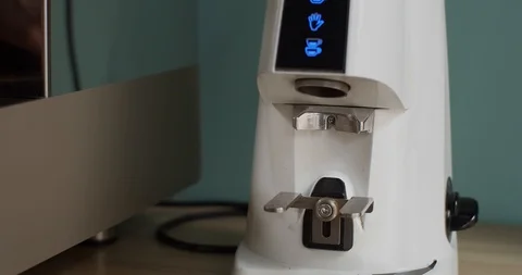 Electric Grinder Grinds Coffee Beans Into Portafilter.  Stock Footage 113729325