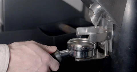 Electric Grinder Grinds Coffee Beans. Barista Preparing Ground Coffee In Filter Stock Footage 131129423