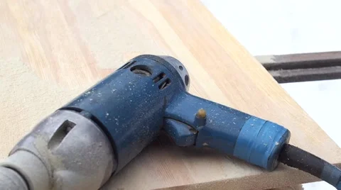 Electric grinder machine work on new wooden plank with wood shavings Stock Footage 67186931