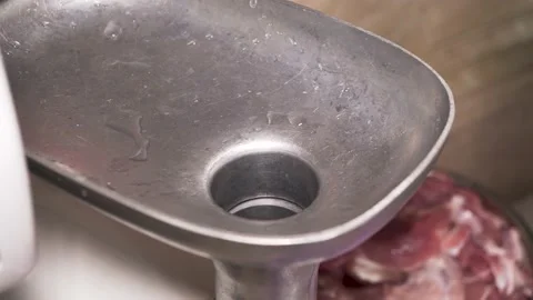 Electric grinder makes minced meat from raw meat Stock Footage 135728061