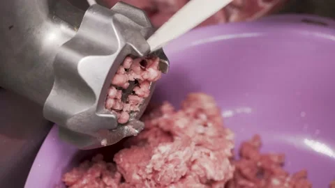 Electric grinder makes minced meat from raw meat 動画素材 135728681