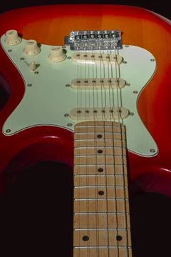 Electric guitar on a black background, isolated on a dark background Stock Photos