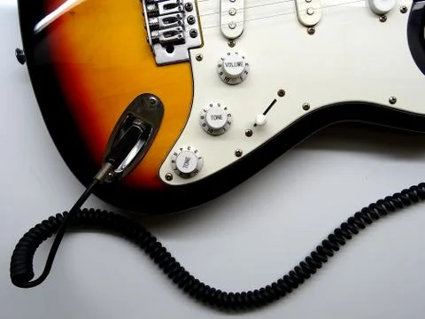 Electric Guitar With Coiled Jack Plug Cable Stock Photos