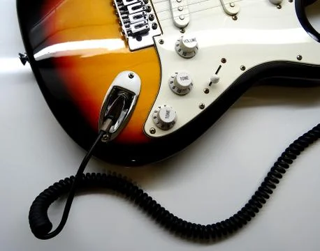 Electric Guitar With Coiled Jack Plug Cable Stock Photos
