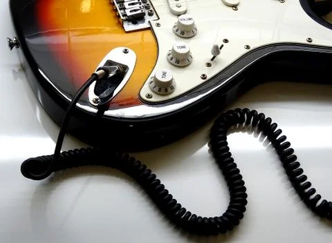 Electric Guitar With Coiled Jack Plug Cable Stock Photos
