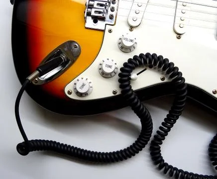 Electric Guitar With Coiled Jack Plug Cable Stock Photos