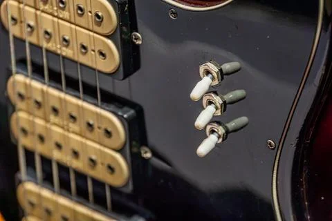 Electric Guitar Control Panel with Toggle Switches and Strings Stockfoto's