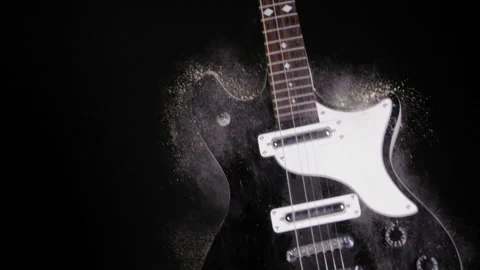 ELECTRIC GUITAR DROPS INTO FRAME.  SLOW MOTION, 180 FPS.  NO PEOPLE. Stock Footage 164169038