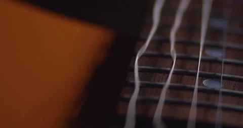 Electric Guitar, Macro Close up. String vibrate on Rosewood neck. Stock Footage 145772334