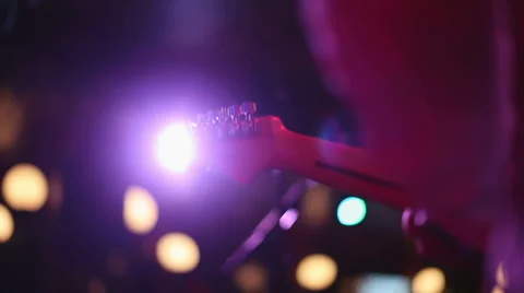 Electric guitar playing on stage at rock concert Stock Footage