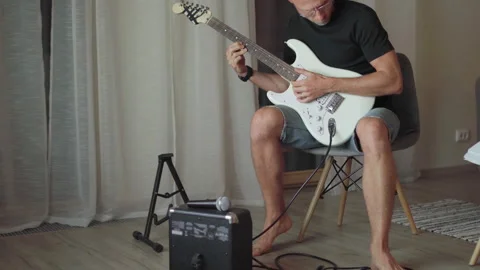 Electric guitar string instrument video. Man playing nylon strings during music  Stock Footage 329746304