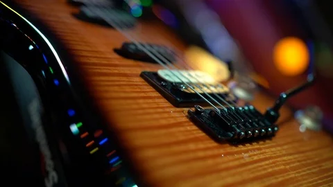 Electric guitar, strings and brown wooden body Stock Footage 126393424