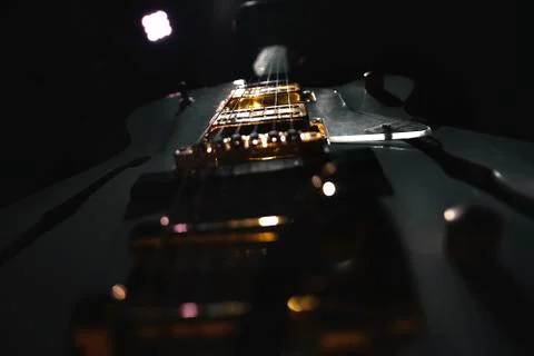 Electric guitar strings close up shot in dark enviroment Stock Photos