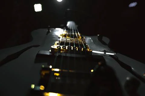 Electric guitar strings close up shot in dark enviroment Stock Photos