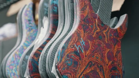 Electric guitars with beautiful patterns at the workshop, guitar industry Stock Footage 274474288