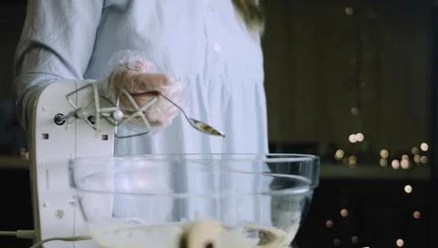 Electric Hand Mixer Working Through Pale Cookie Batter Stock Photos