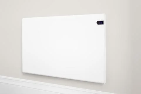 Electric heating panel radiator on a wall. Home interior, UK Stock Photos