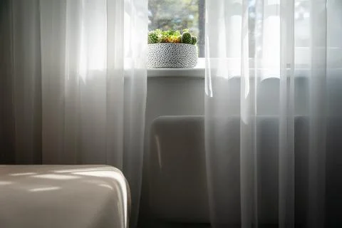 Electric heating radiator under window in room Stock Photos