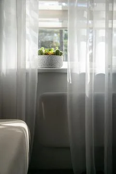 Electric heating radiator under window in room Stock Photos