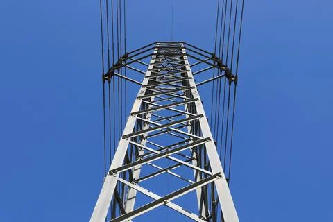 Electric high voltage power post with blue sky Stock Photos