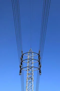 Electric high voltage power post with blue sky Stock Photos
