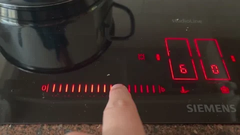 Electric induction cooktop Stock Footage 219558300