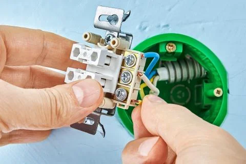 Electric installation work with push button. Stock Photos