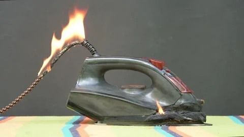 An electric iron caught fire, the ironin... | Stock Video | Pond5