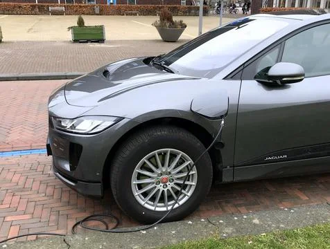 Electric Jaguar I-Pace being charged Stock Photos